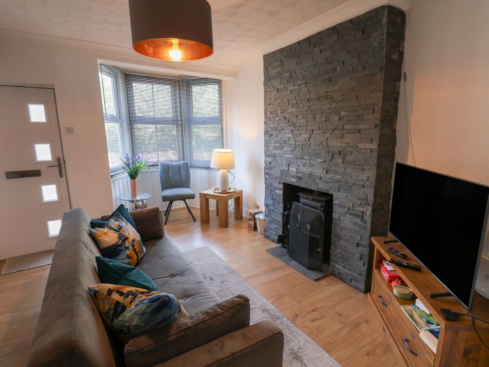A living room with a sofa and television at 174 High Street Marske-By-The-Sea
