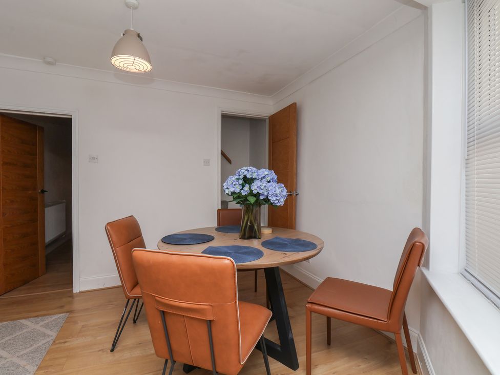 A dining room with a table and chairs at 174 High Street in Marske-By-The-Sea