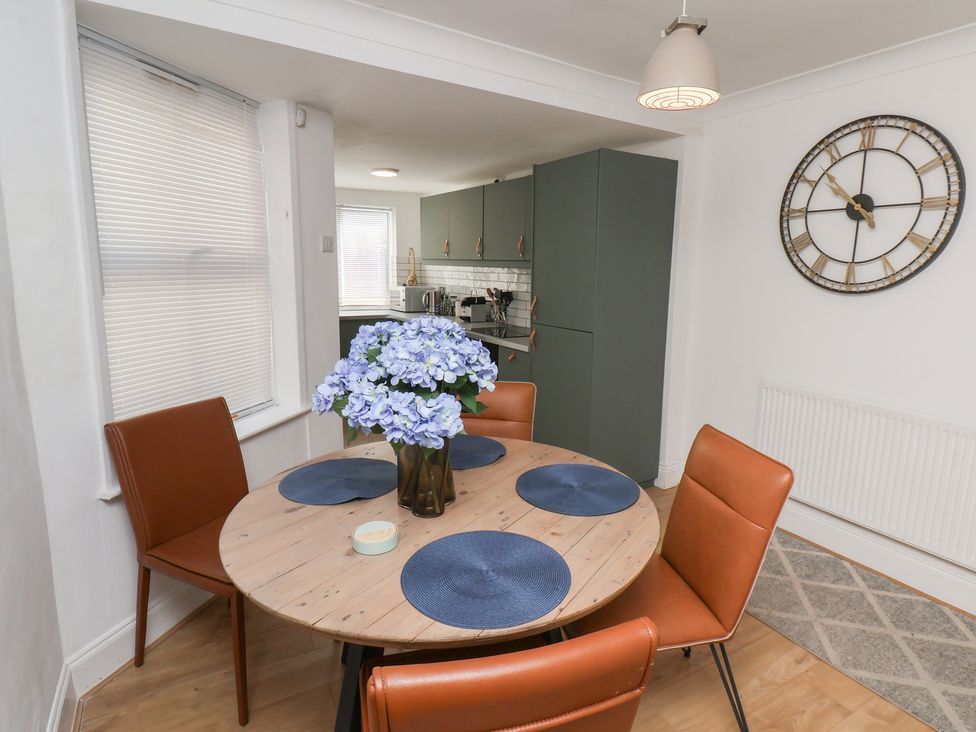 A dining room with a table and chairs at 174 High Street, Marske-By-The-Sea
