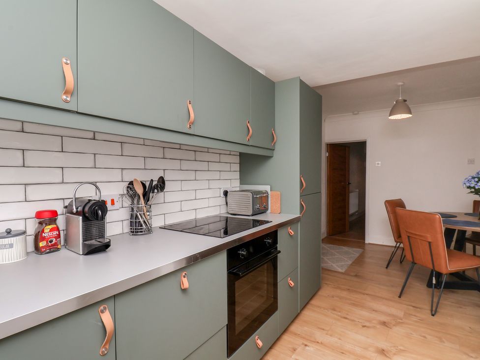 A kitchen with cabinets and appliances at 174 High Street Marske-By-The-Sea