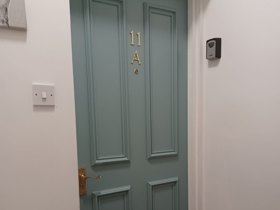 A door with number 11A and a keypad at 11A High Street in Jedburgh