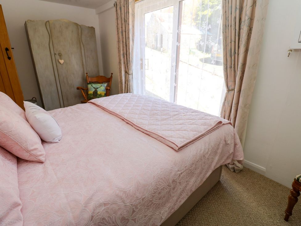 A bedroom with bed and wardrobe at The Museum in Nenthead