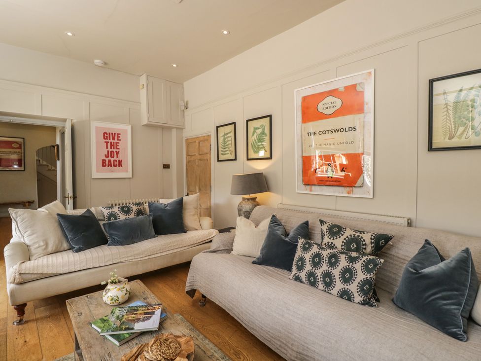 A living room with sofas and wall art at Cotswold House Moreton-In-Marsh