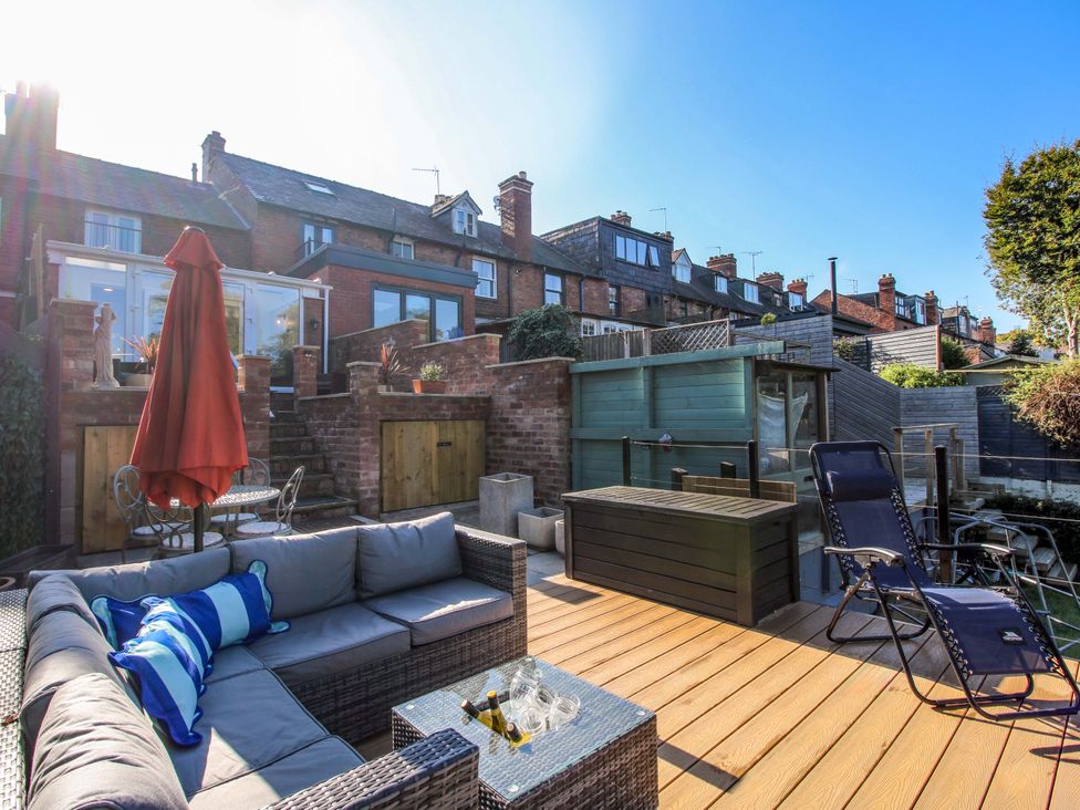 A garden with seating area and steps at Riverside Cottage in Shrewsbury
