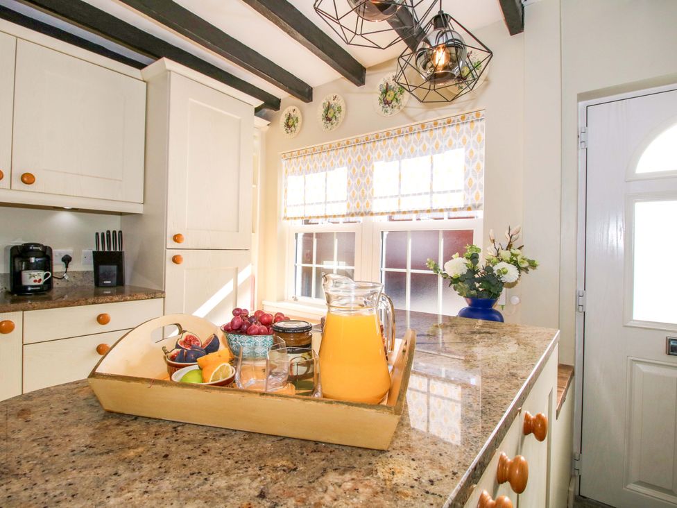 A kitchen with a countertop and coffee machine at Riverside Cottage in Shrewsbury