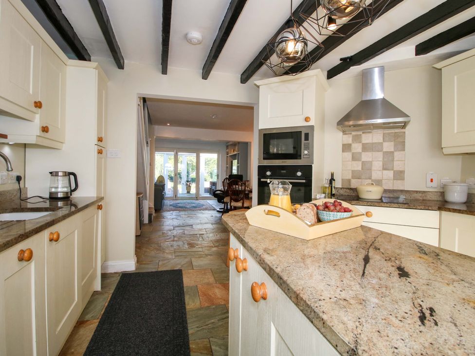 A kitchen with a countertop and appliances at Riverside Cottage in Shrewsbury