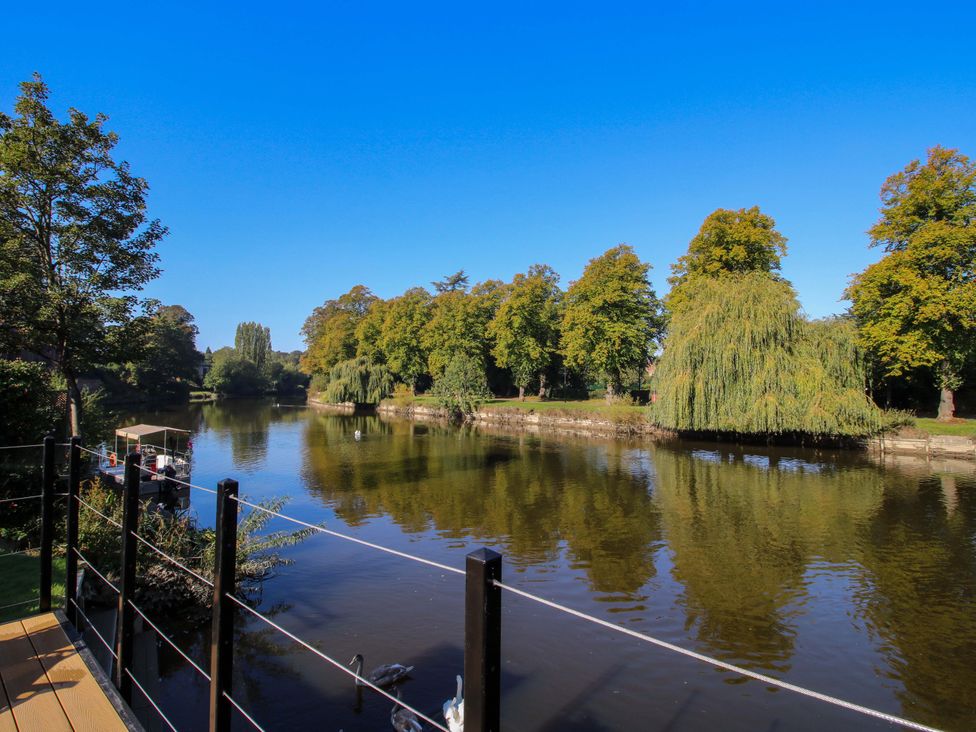 A view of a river surrounded by trees at Riverside Cottage in Shrewsbury