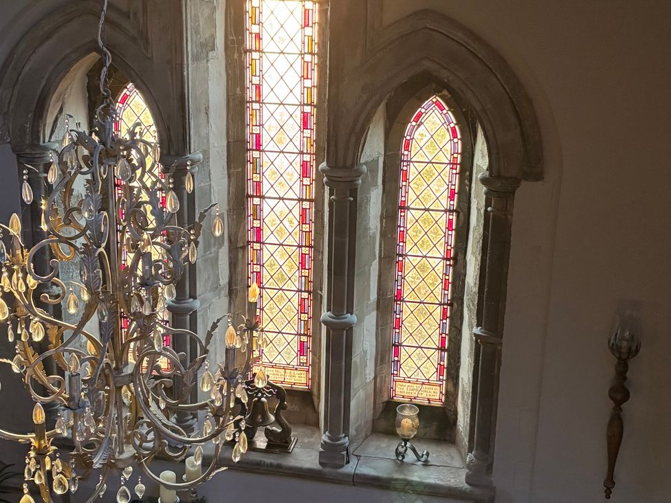 A chandelier and stained glass windows at St Edmunds Church in Fraisthorpe