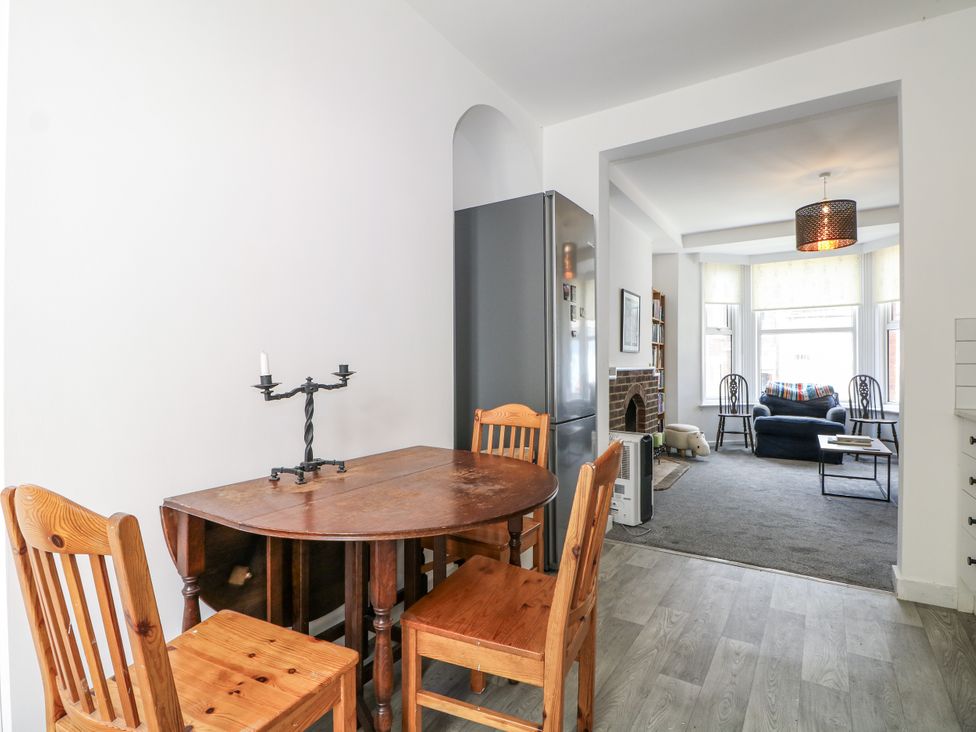A kitchen with a dining table and chairs at 108 Emmanuel Road in Hastings