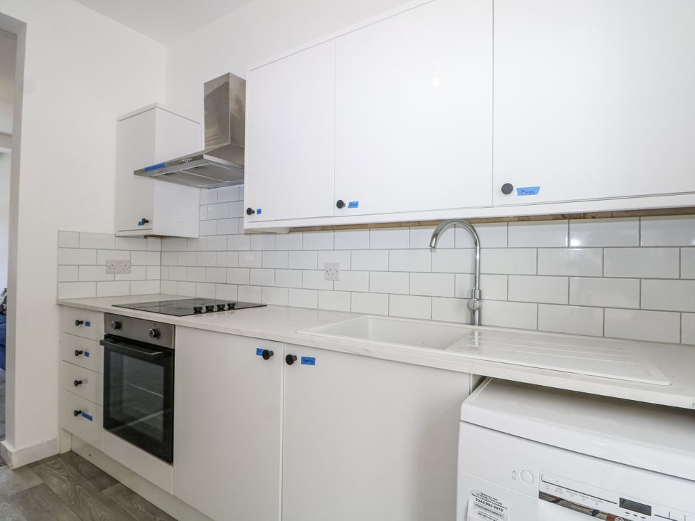 A kitchen with cabinets and appliances at 108 Emmanuel Road Hastings