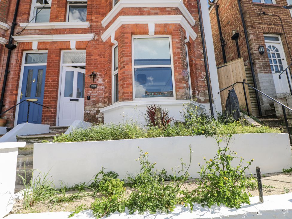 A house exterior with a front door and window at 108 Emmanuel Road in Hastings