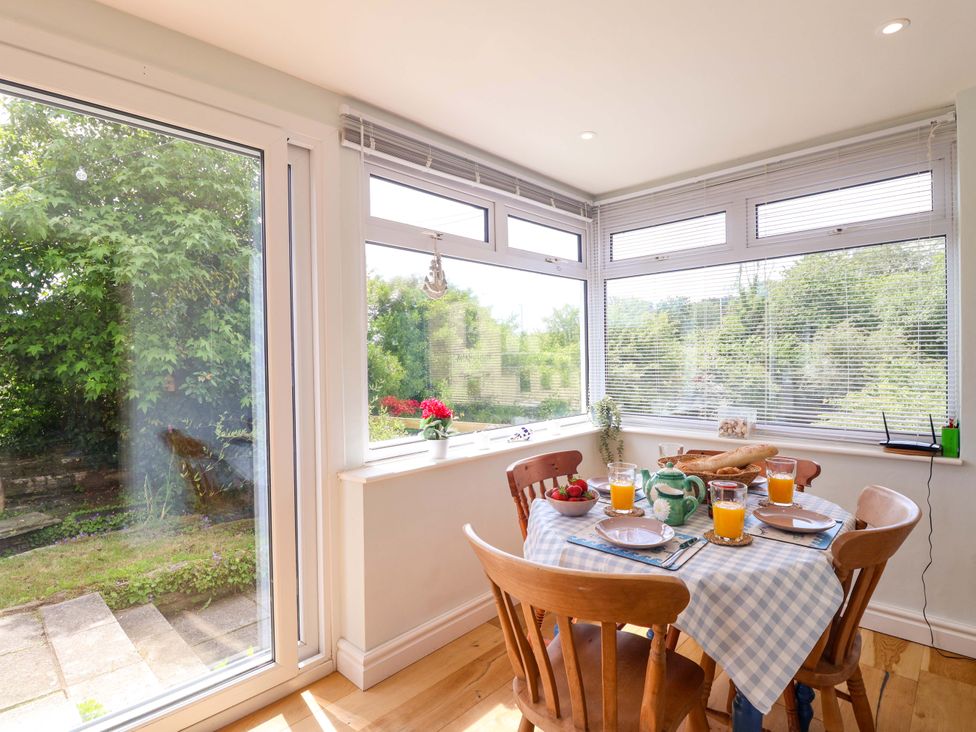 A dining room with a table set for breakfast at Walnut Major in Kingsbridge