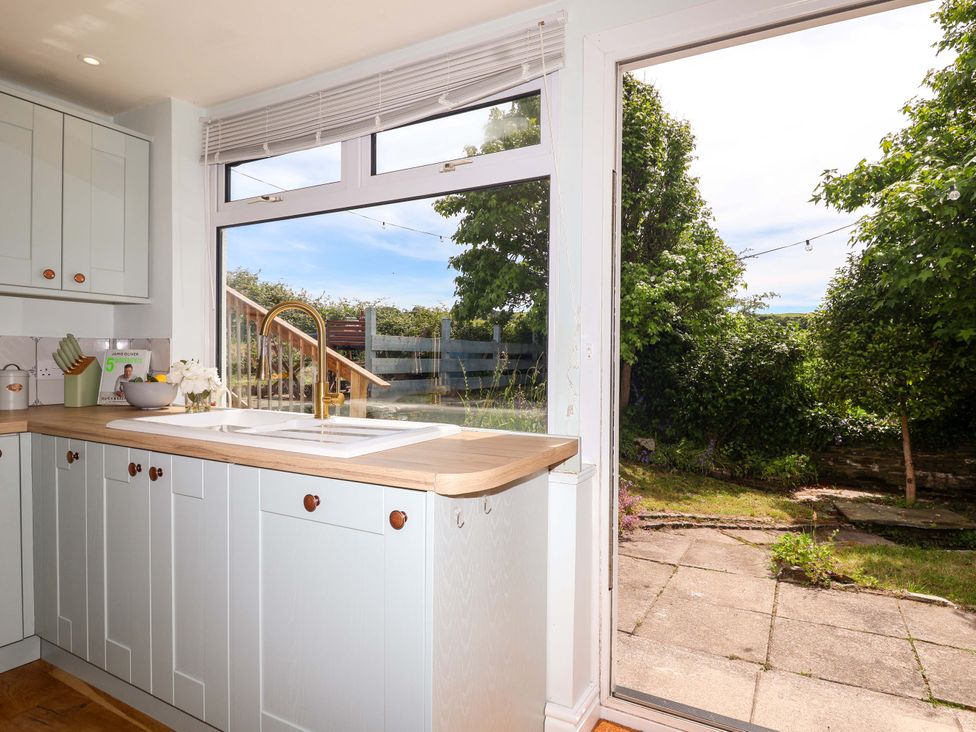 A kitchen with a sink and window at Walnut Major in Kingsbridge