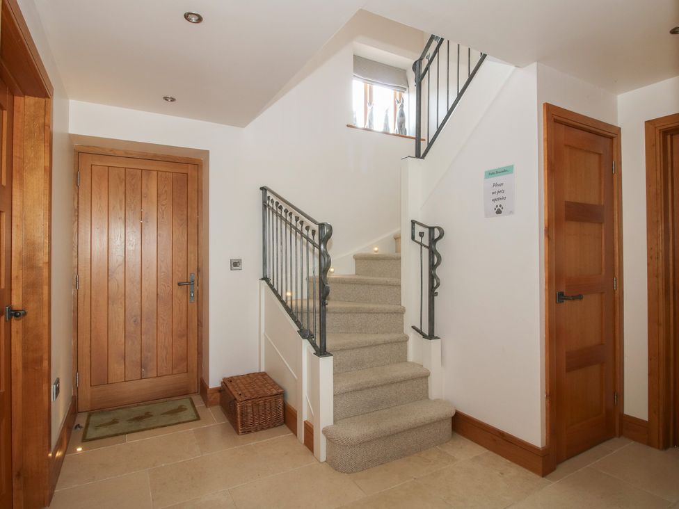 An entryway with a staircase and doors at the White House in Montgomery