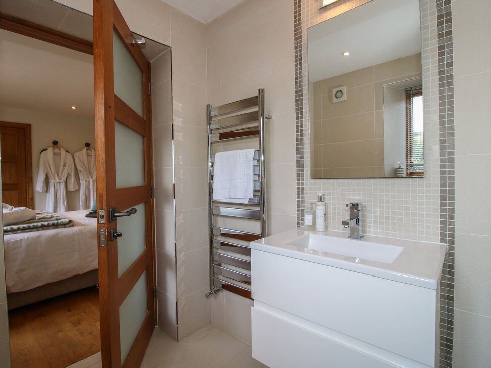 A bathroom with a sink and towel warmer at White House in Montgomery