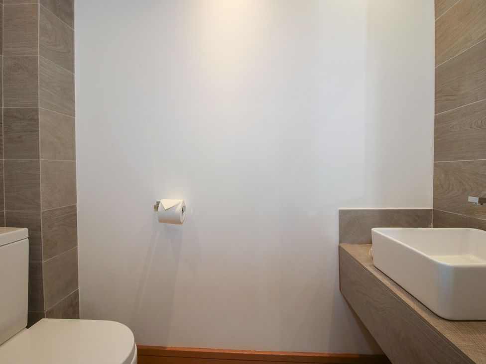 A bathroom with a toilet and sink at White House in Montgomery