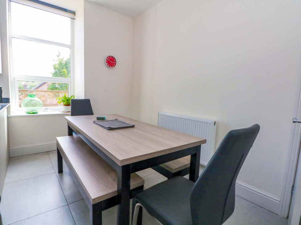 A dining area with a table and chairs at 163 Manchester Road in Accrington