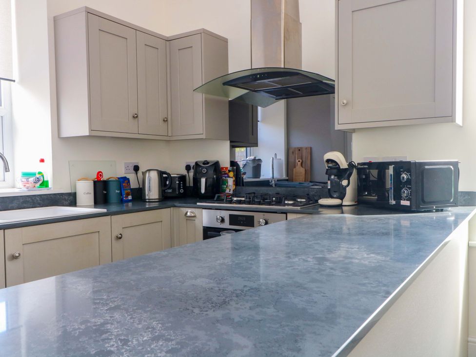 A kitchen with cabinets and countertop appliances at 163 Manchester Road, Accrington