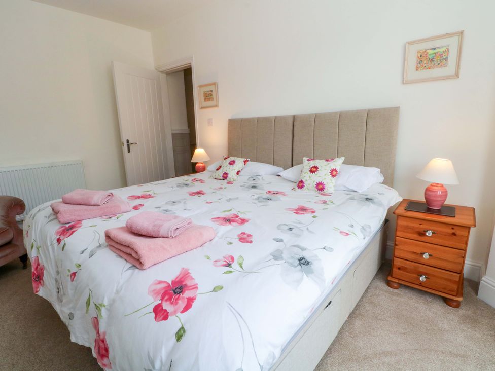 A bedroom with a bed and bedside table at 163 Manchester Road in Accrington