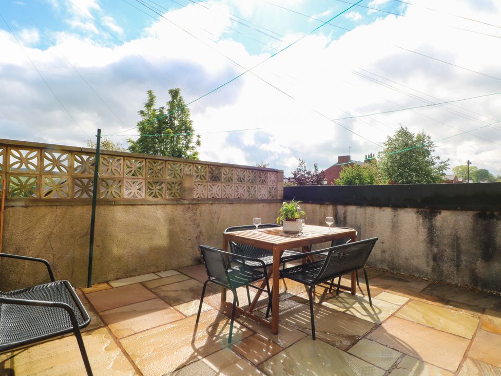 An outdoor space with a table and chairs at 163 Manchester Road Accrington
