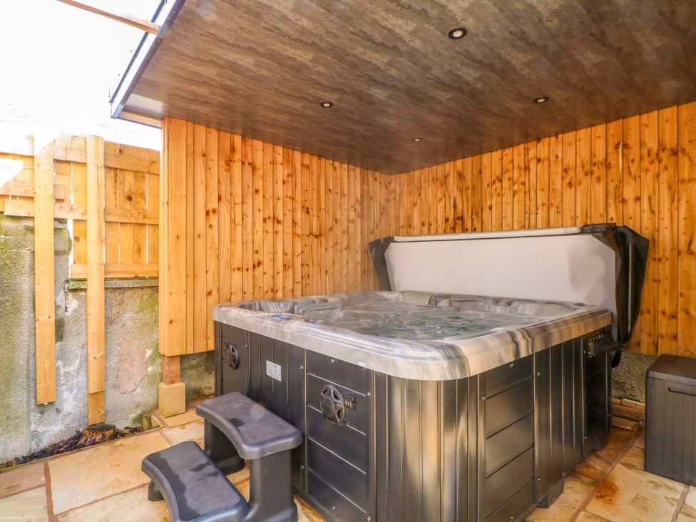 A hot tub with steps in an outdoor area at 163 Manchester Road, Accrington