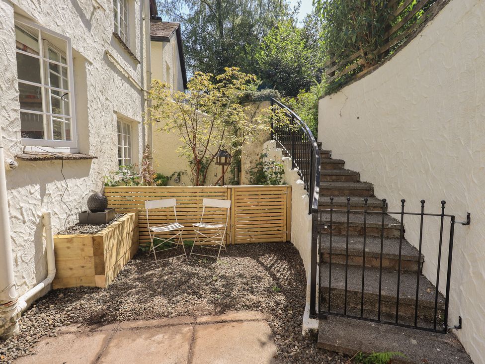 An outdoor area with stairs and chairs at Daffodils in Ambleside