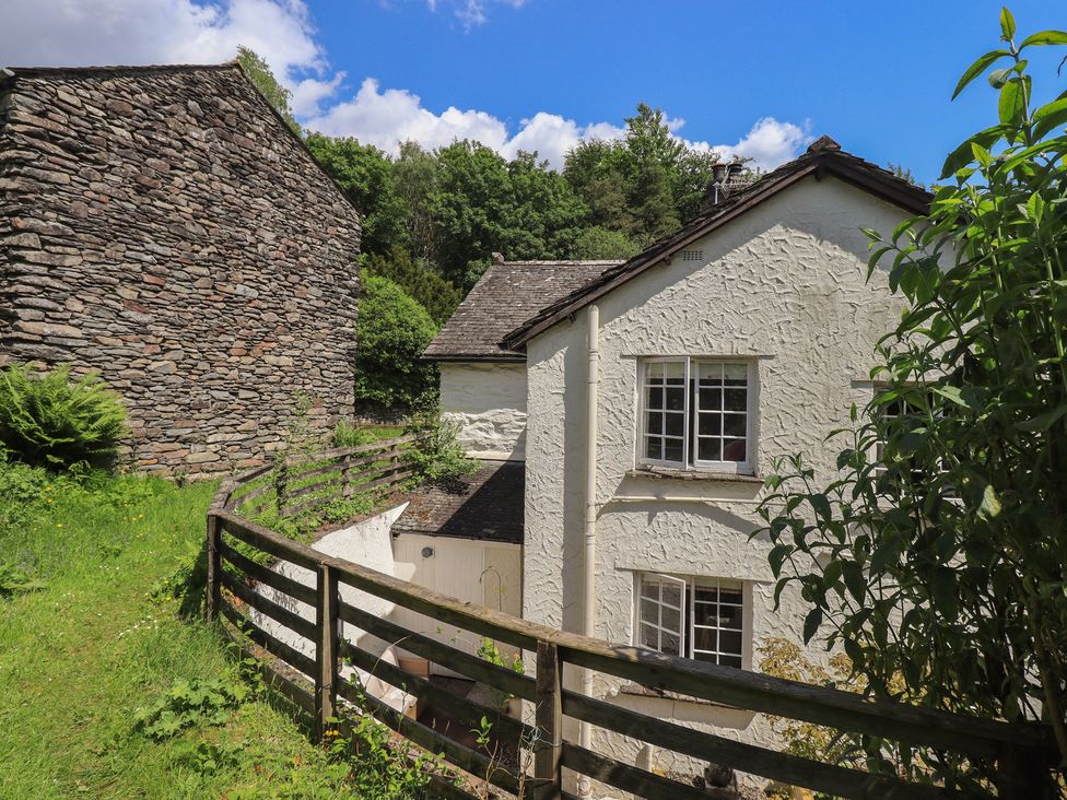 An outdoor view of a house with a fence in Daffodils Ambleside