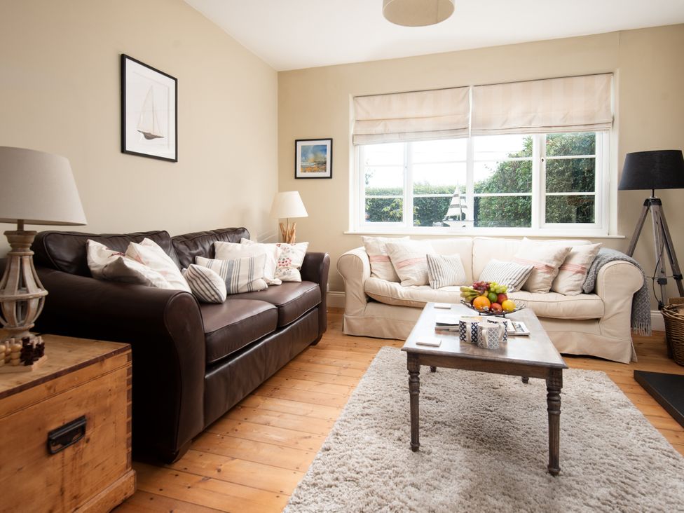 A living room with a sofa and coffee table at Driftwood in Embleton