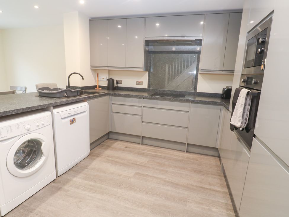 A kitchen with appliances and countertop at Boslowen, Portreath
