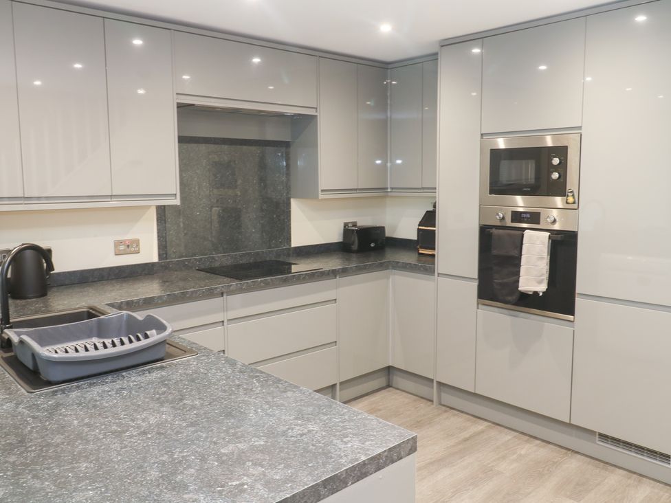A kitchen with a sink and appliances at Boslowen Portreath