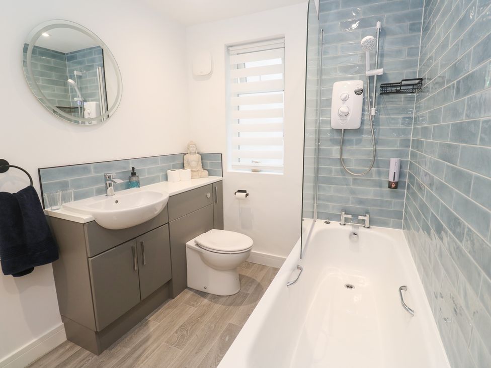 A bathroom with a sink and a bathtub at Boslowen in Portreath
