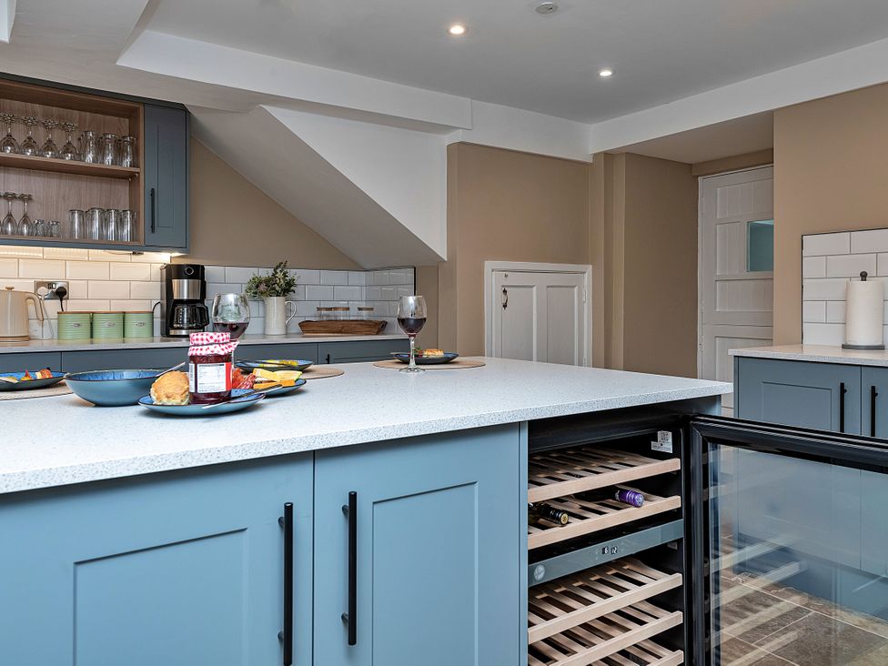 A kitchen with a wine cooler and coffee maker at Snowdonia Manor in Dolgellau