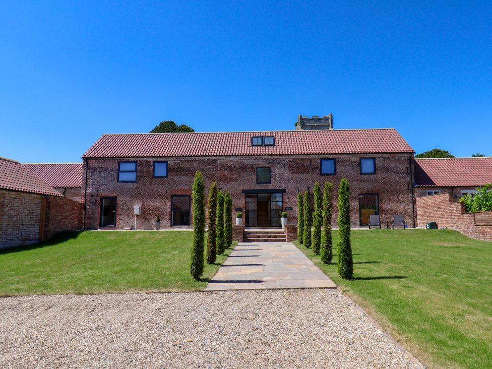 A house with trees and a pathway at Plot Four - Italian Terraced Garden Harpham near Nafferton