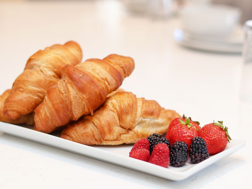 A platter with croissants and mixed berries at Plot Four - Italian Terraced Garden Harpham near Nafferton