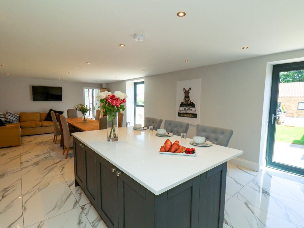 A kitchen with dining area and seating at Plot Four - Italian Terraced Garden Harpham near Nafferton