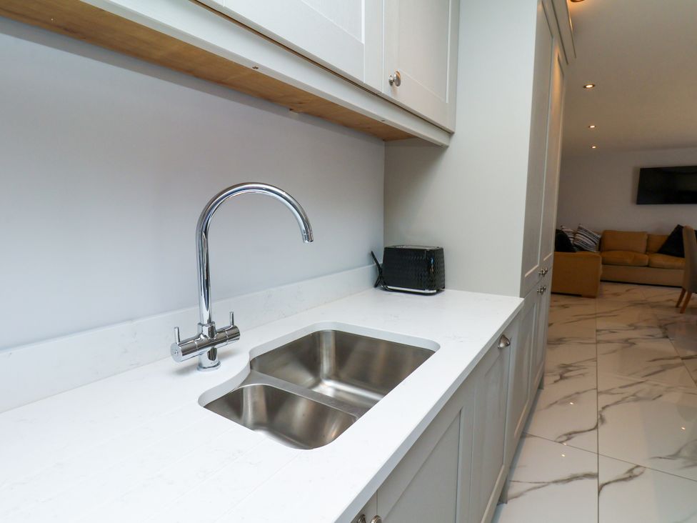 A kitchen with a sink and countertop at Plot Four - Italian Terraced Garden, Harpham near Nafferton