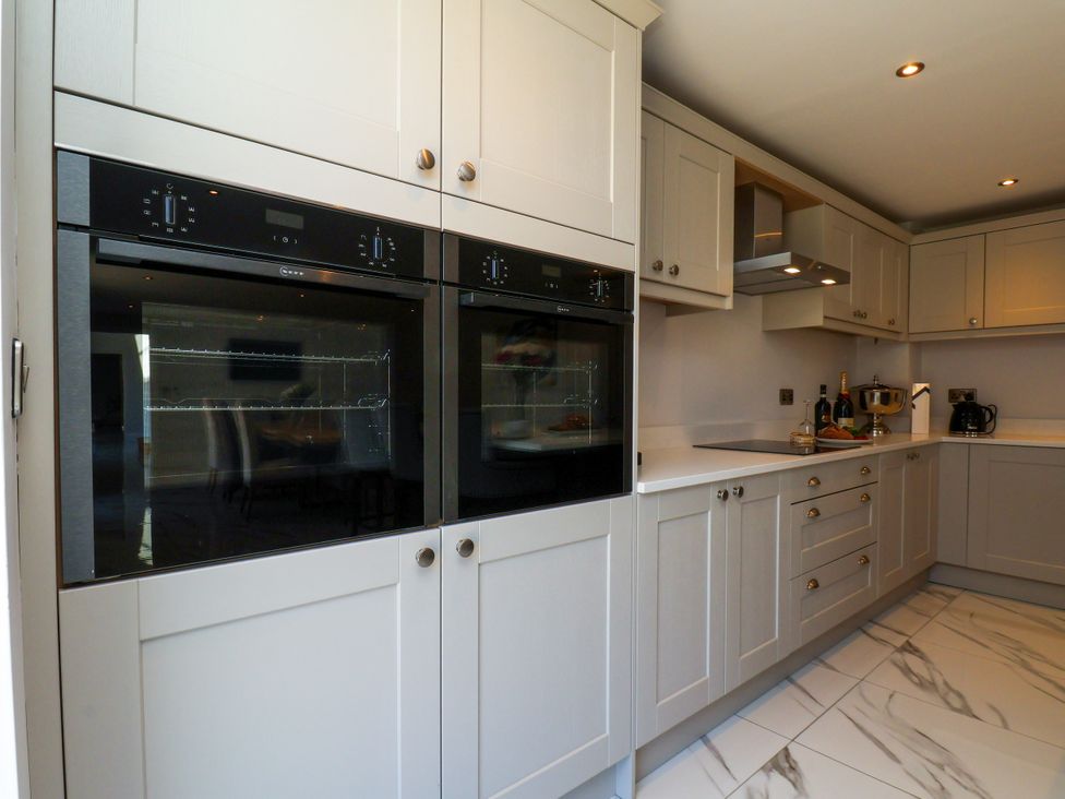 A kitchen with ovens and cabinets at Plot Four - Italian Terraced Garden Harpham near Nafferton