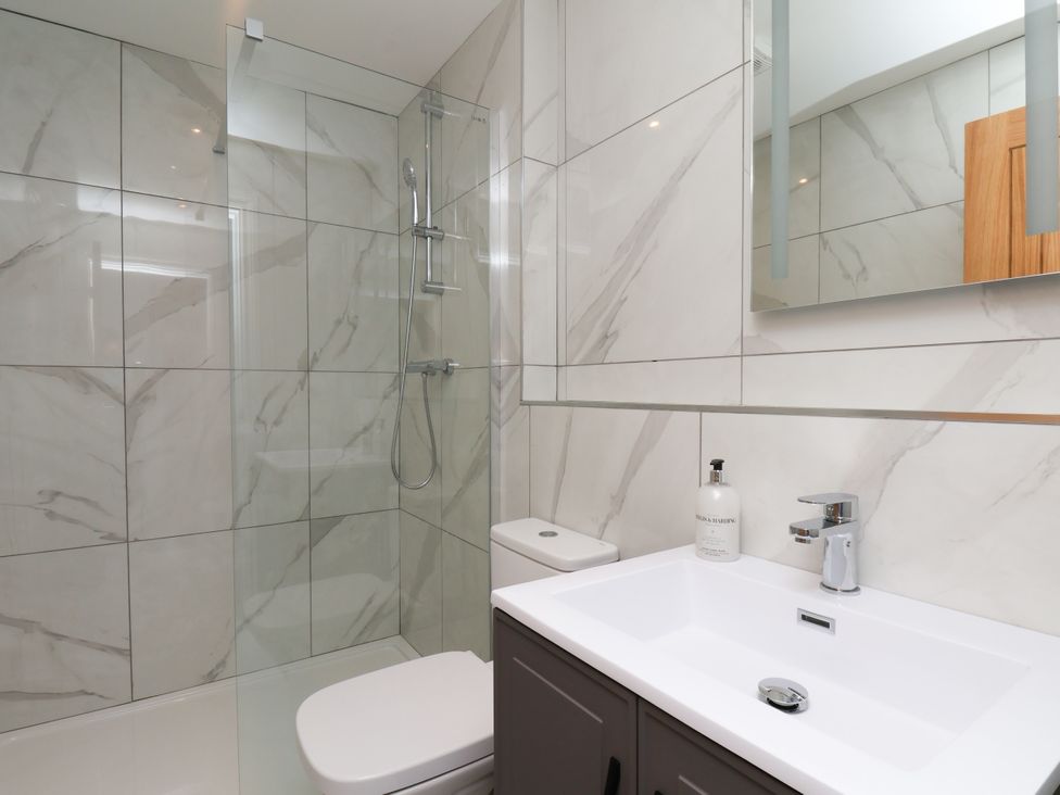 A bathroom with a shower, toilet and sink at Plot Four - Italian Terraced Garden, Harpham near Nafferton