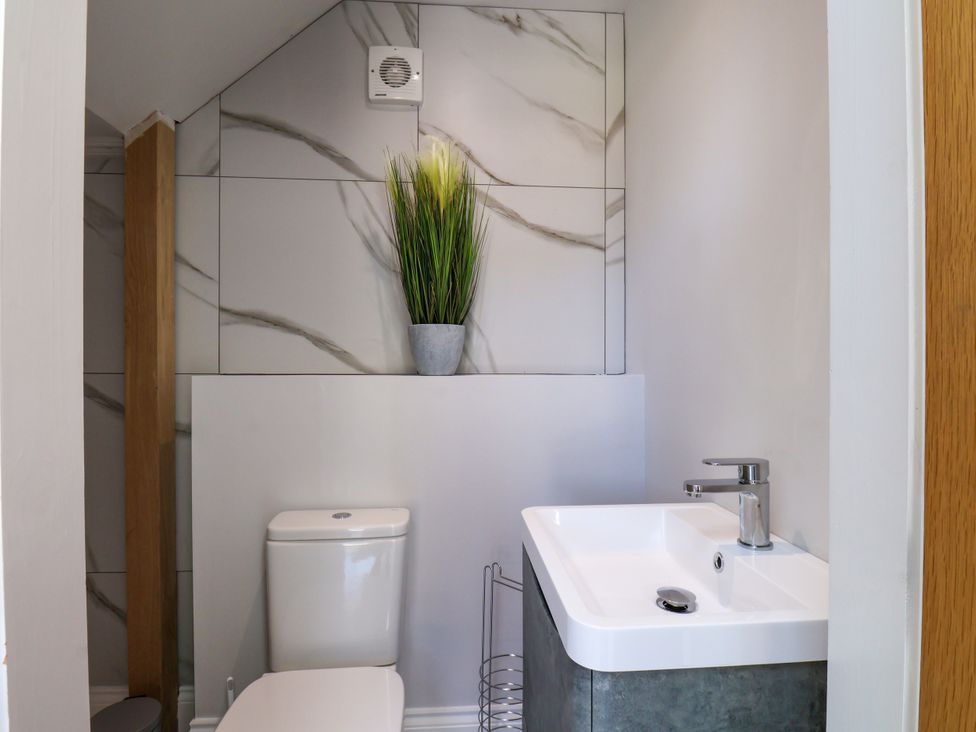 A bathroom with a toilet and sink at Plot Four - Italian Terraced Garden near Harpham near Nafferton