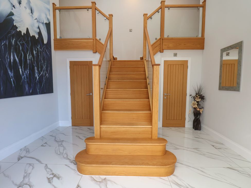 A staircase leading to upper floors at Courtenay House in Harpham near Nafferton