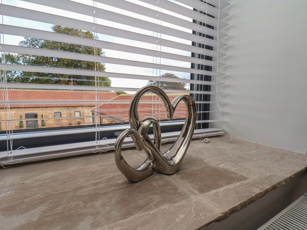 A decorative object on a windowsill at Courtenay House in Harpham near Nafferton