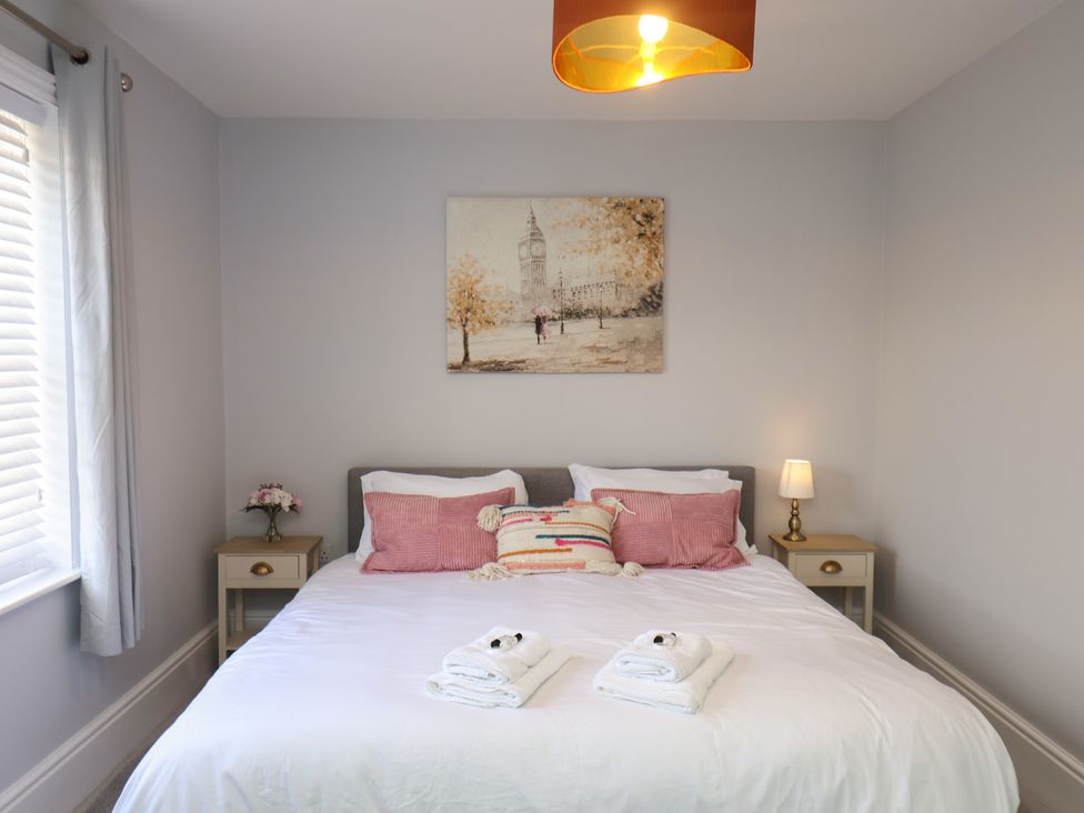 A bedroom with a bed and bedside table at Harpham Manor House Harpham near Nafferton