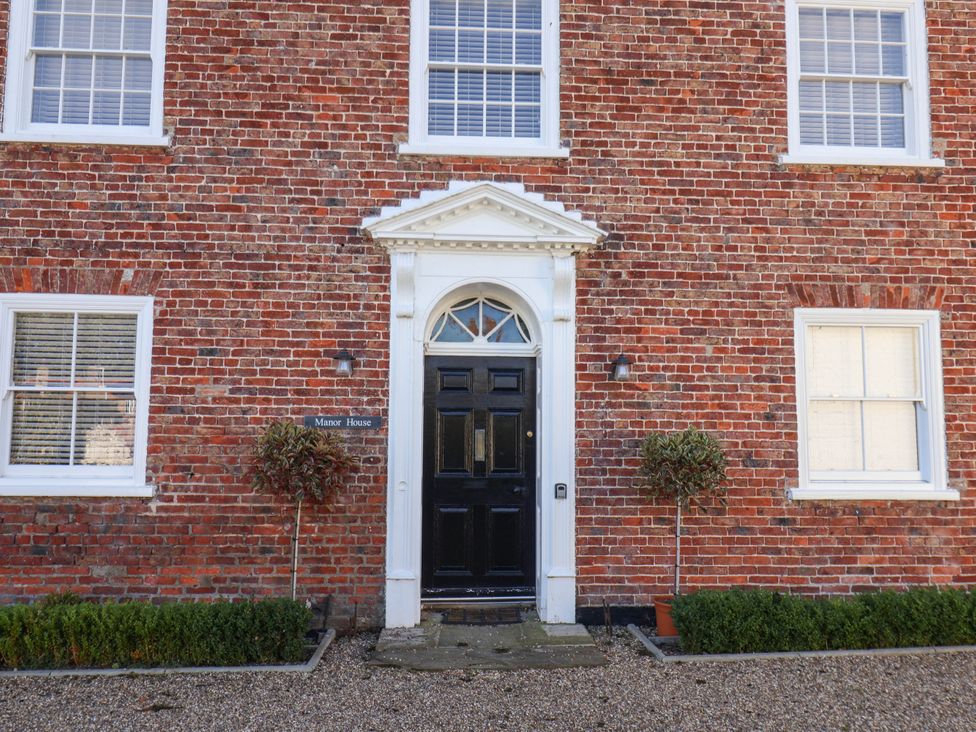 The front entrance of Manor House with brick facade at Harpham Manor House Nafferton