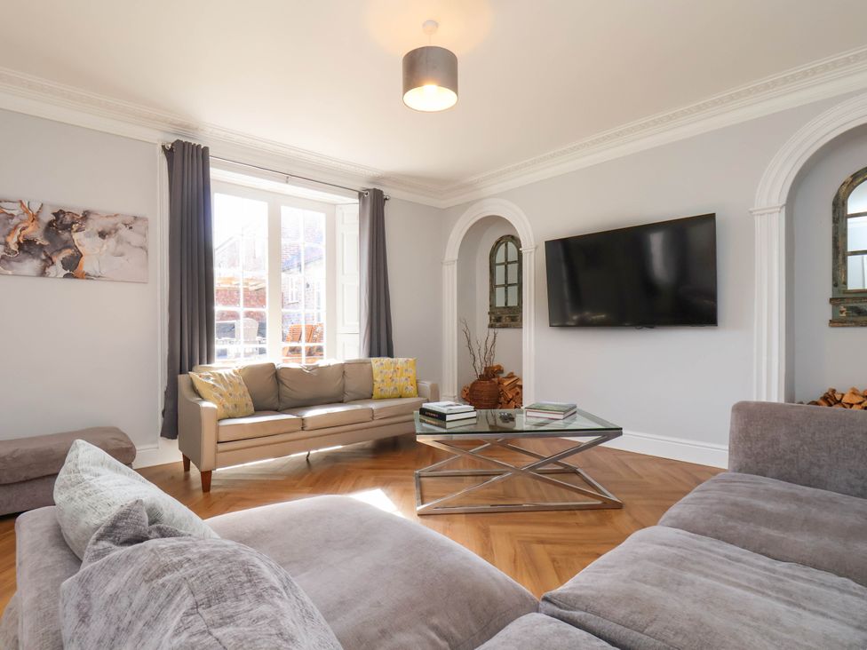 A living room with a couch and coffee table at Harpham Manor House Nafferton