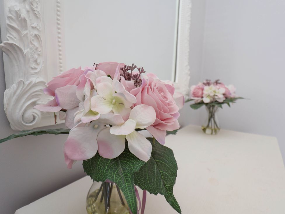 A vase with flowers indoors at Harpham Manor House Nafferton