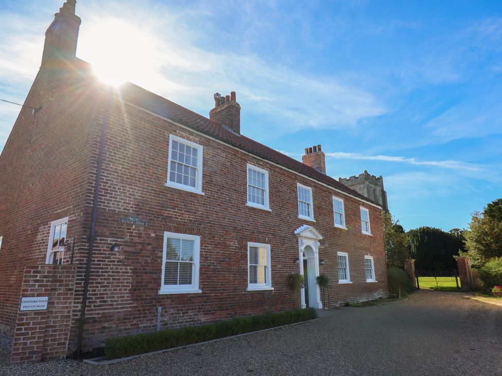 A brick house with windows and a front door at Harpham Manor House Nafferton