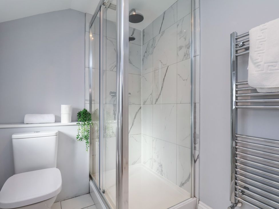 A bathroom with a shower and toilet at Manor Cottage Harpham near Nafferton