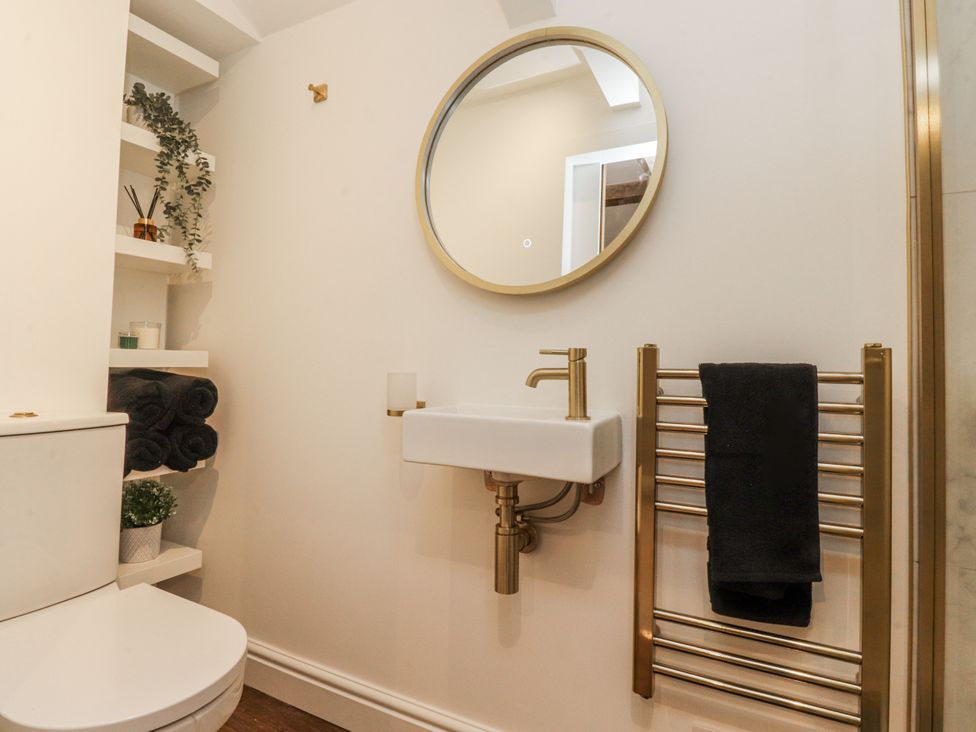 A bathroom with a sink and toilet at Henside Cottage Settle