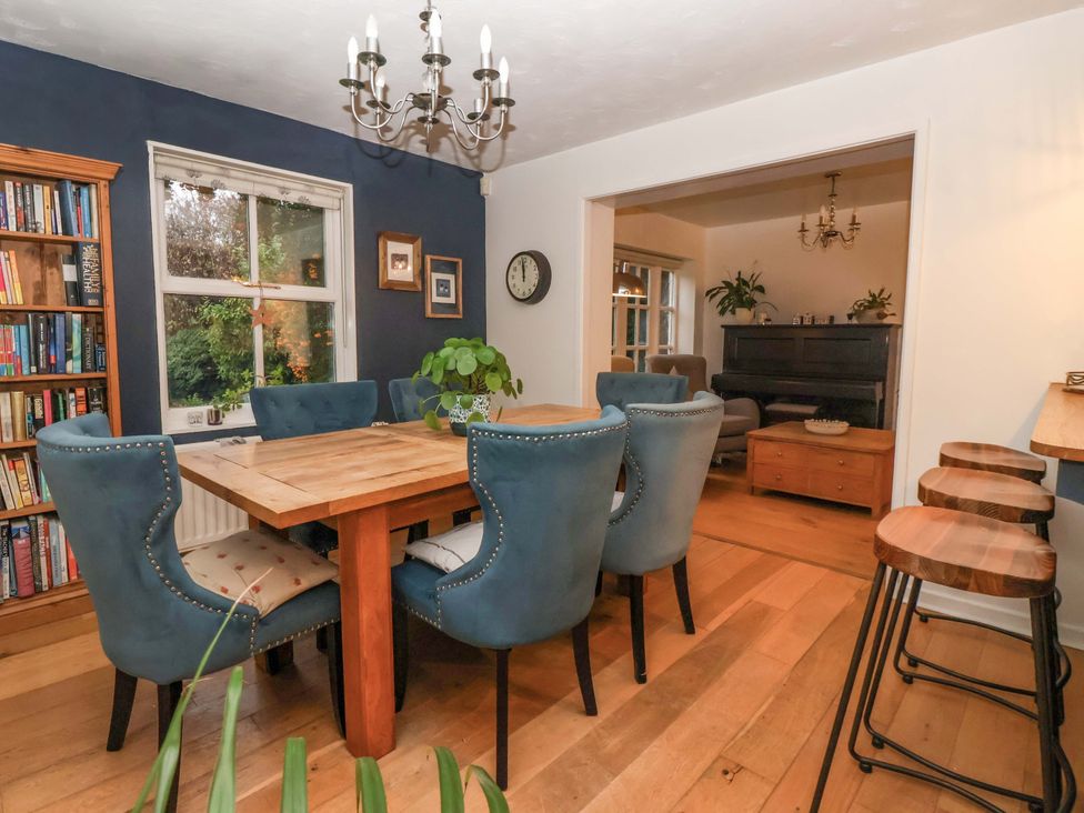 A dining room with a table and chairs at Lair Close House in Harrogate