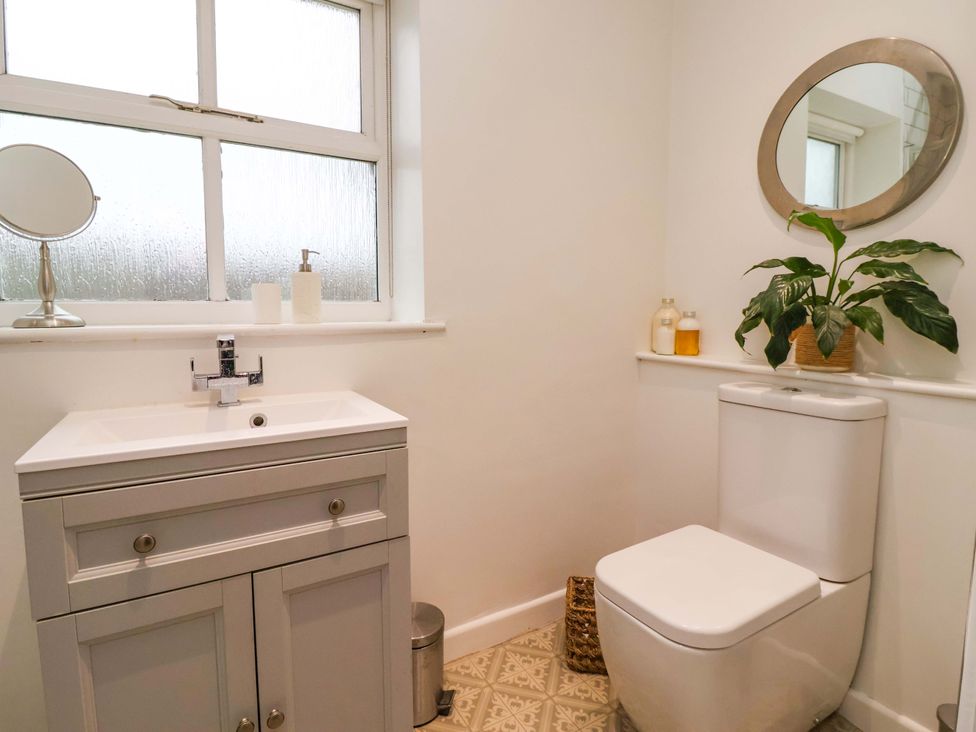 A bathroom with a sink and toilet at Lair Close House in Harrogate